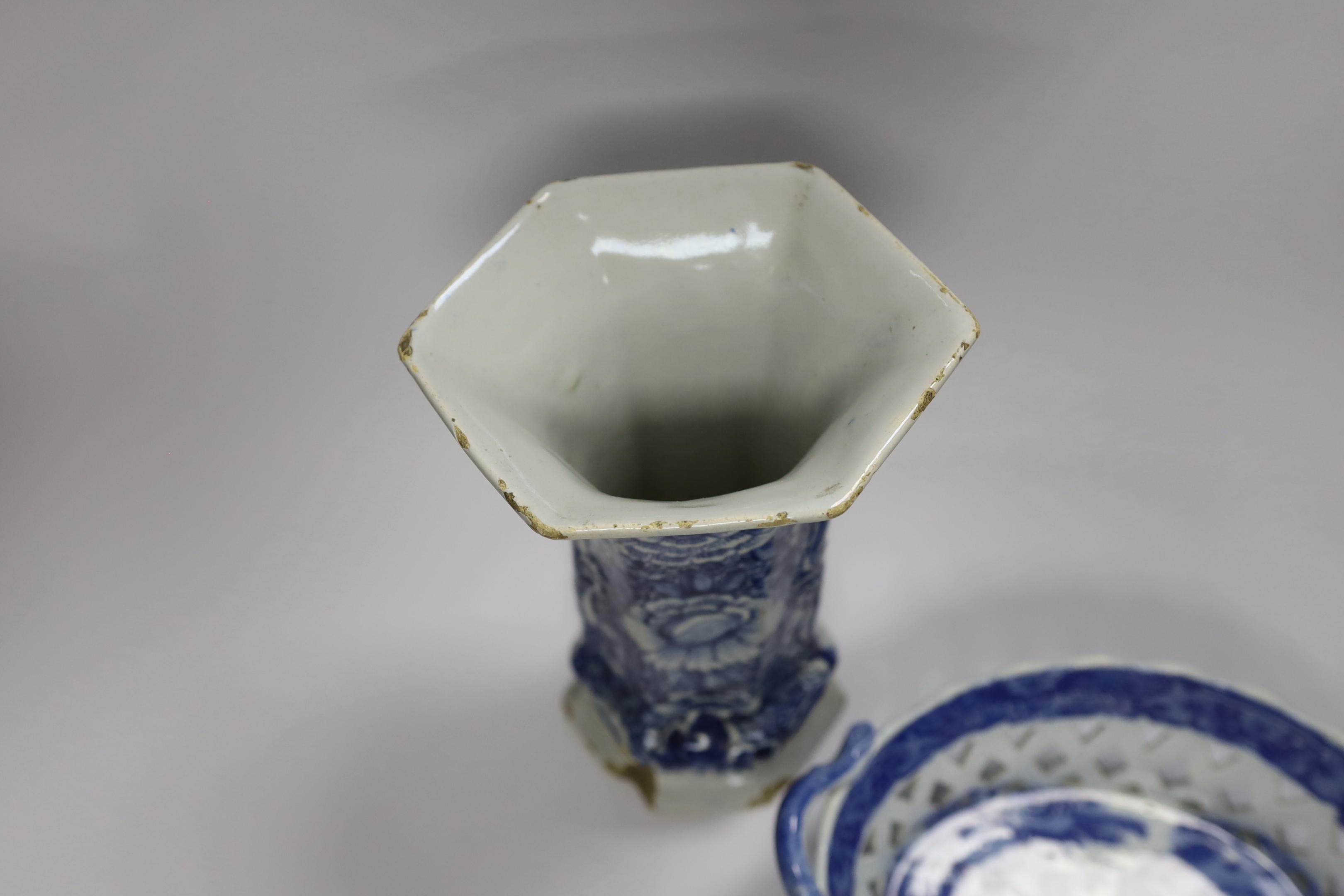 An 18th century hexagonal Delft vase, two pearlware blue and white baskets and a similar dish, tallest 27cm